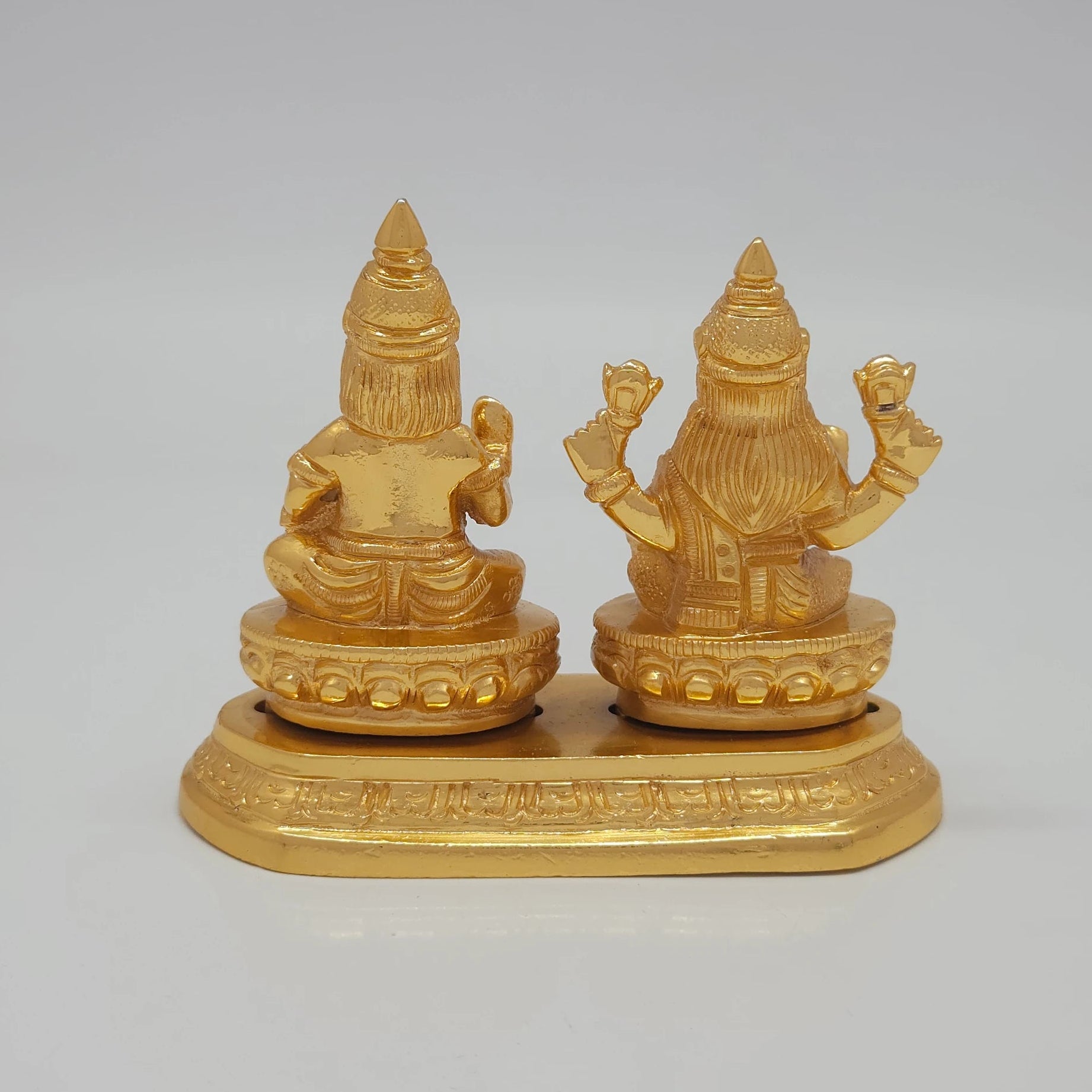 Rear view showcasing the solid back structure of the crowns, the individual lotus base backings, and the flawless mirror-gold luster of the 710g sculpture.