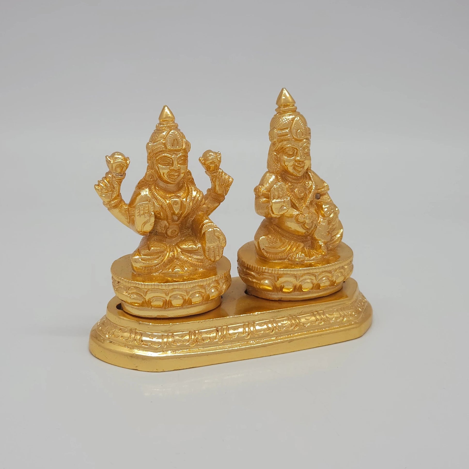 Right 45-degree perspective highlighting Lord Kubera holding his treasure pot, the detailed crown lines, and the polished metal side boundaries.