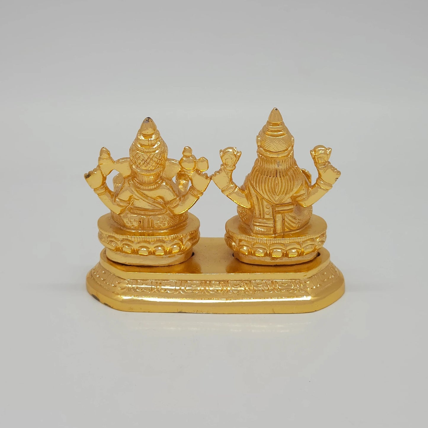 Rear view showcasing the solid back structure of the crowns, the individual lotus base backings, and the flawless mirror-gold luster of the 700g sculpture.