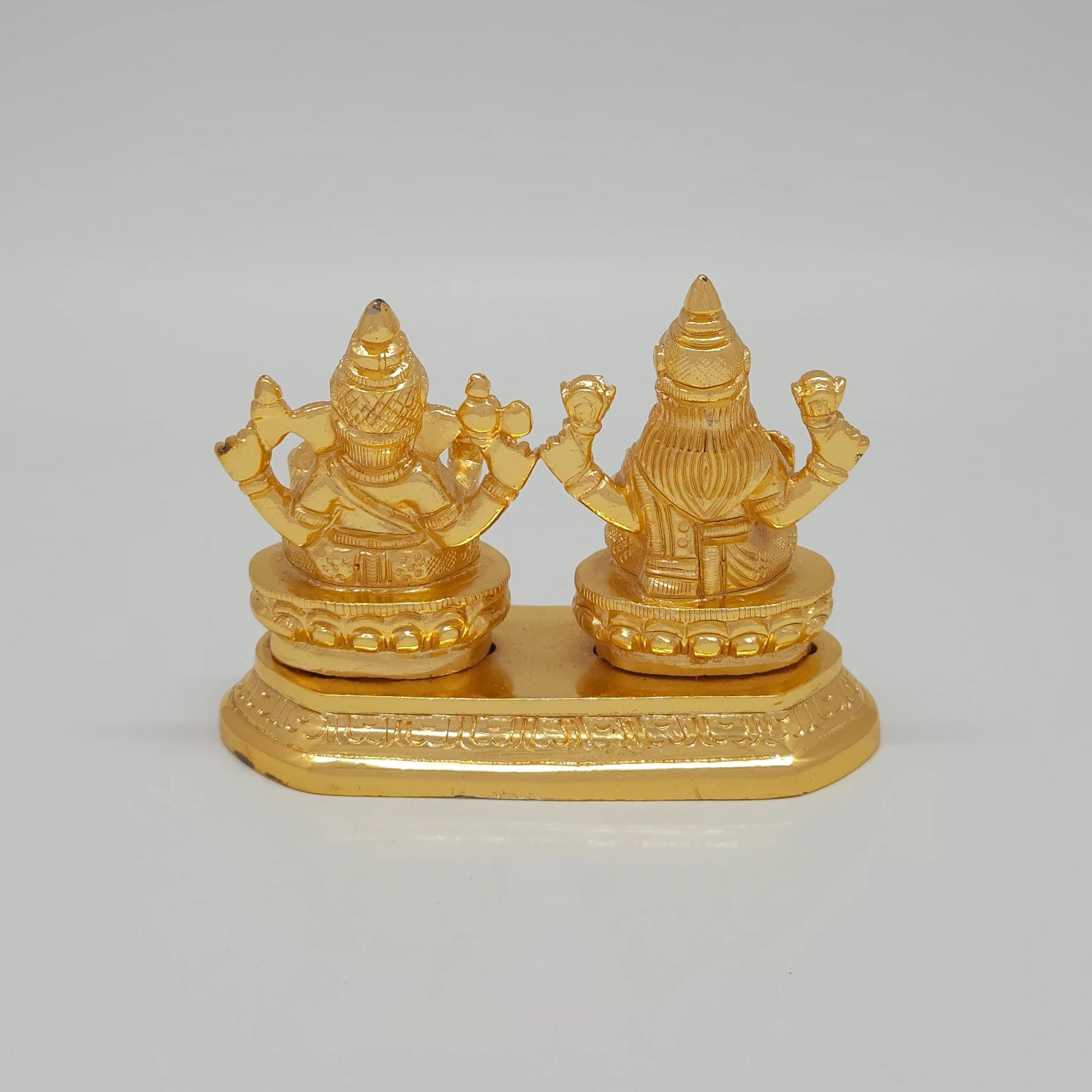 Rear view showcasing the solid back structure of the crowns, the individual lotus base backings, and the flawless mirror-gold luster of the 700g sculpture.