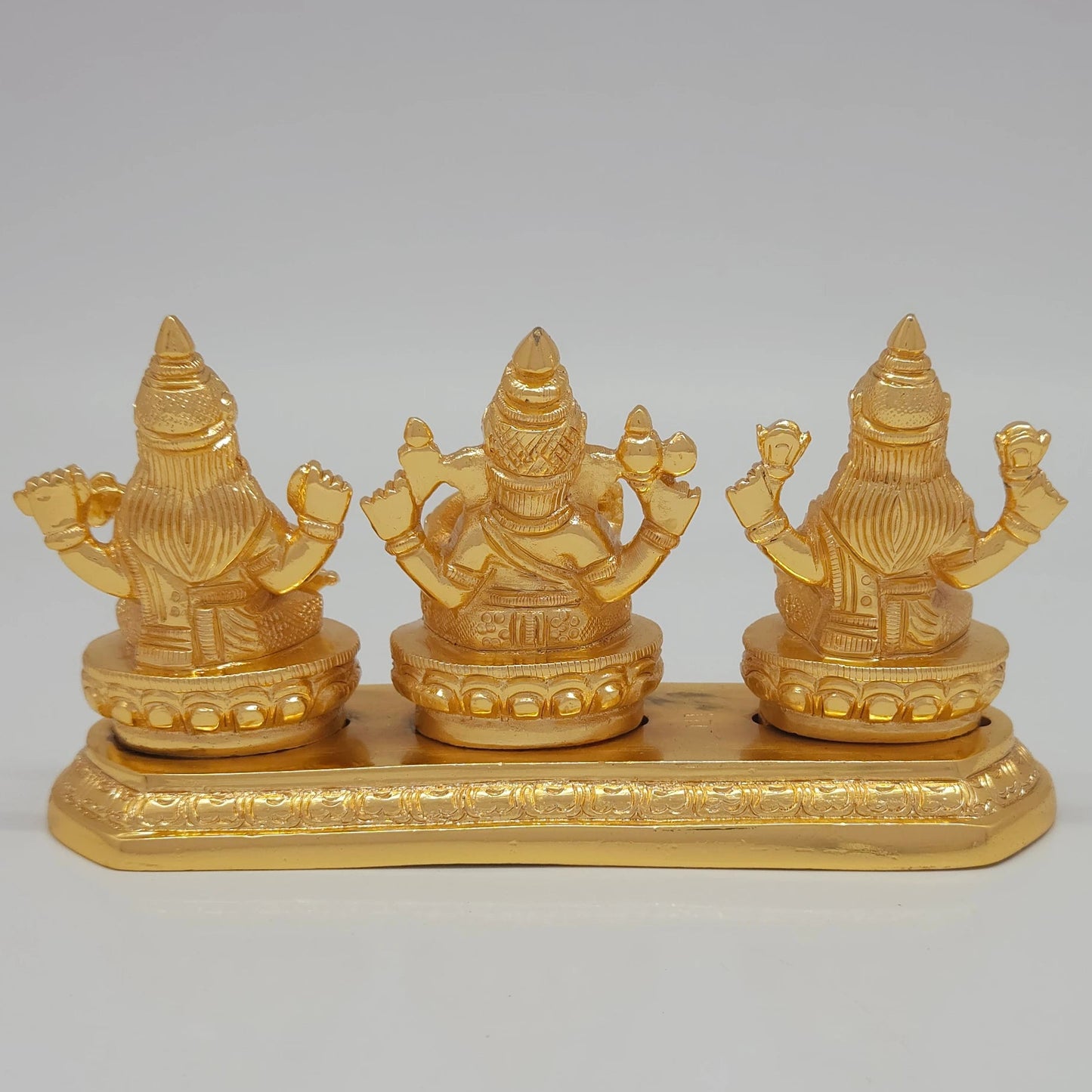 Rear view showcasing the solid back structure of the crowns, the individual lotus base backings, and the flawless mirror-gold luster of the 1.12kg sculpture.