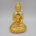 Ariel angle profile of the glossy gold powder-coated Buddha brass figurine highlighting the raised blessing hand