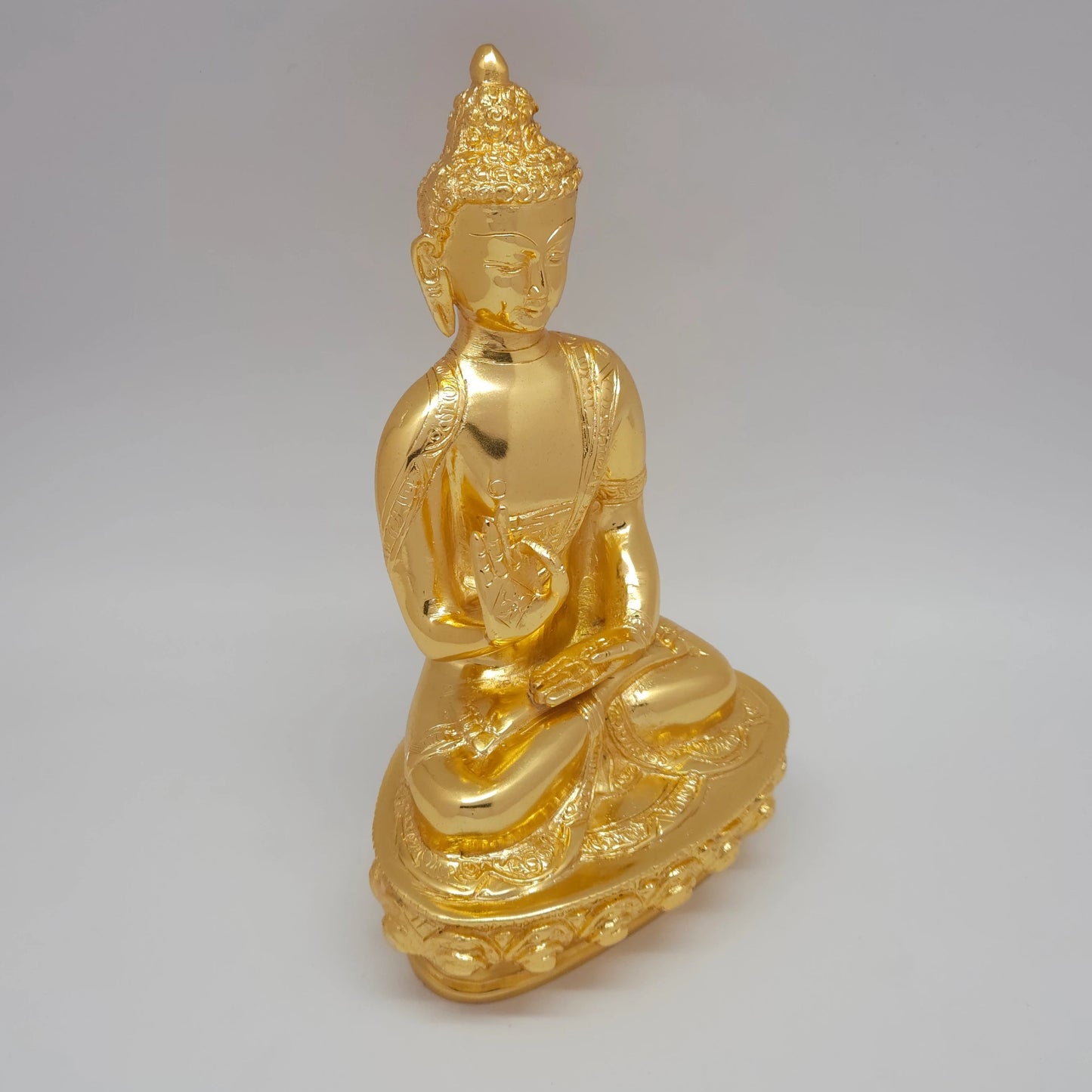 Right 45-degree ariel view of the premium decorative metal Buddha idol on a carved lotus pedestal available globally at Sri Swaminathan & Co.