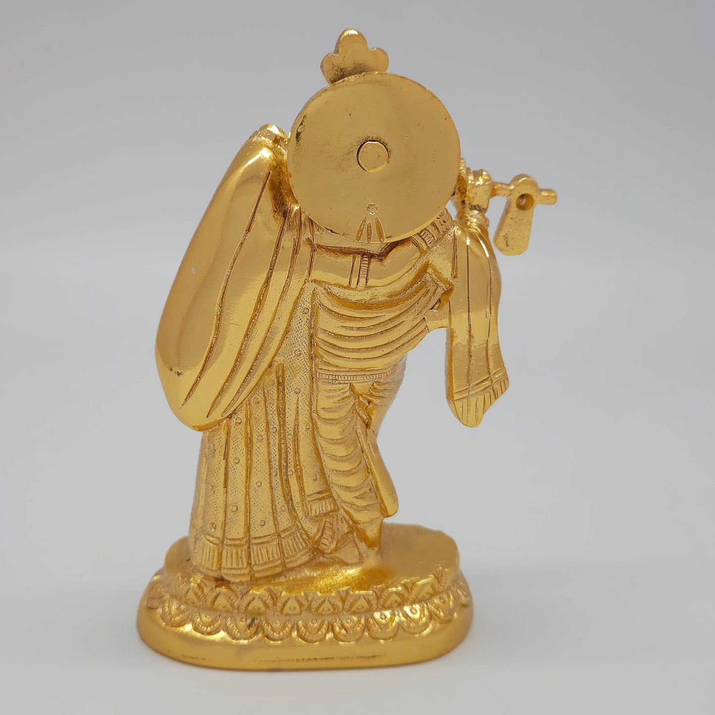 Rear view showcasing the solid back structure of the halos, Radha's flowing veil details, and the flawless mirror-gold luster of the 900g sculpture.