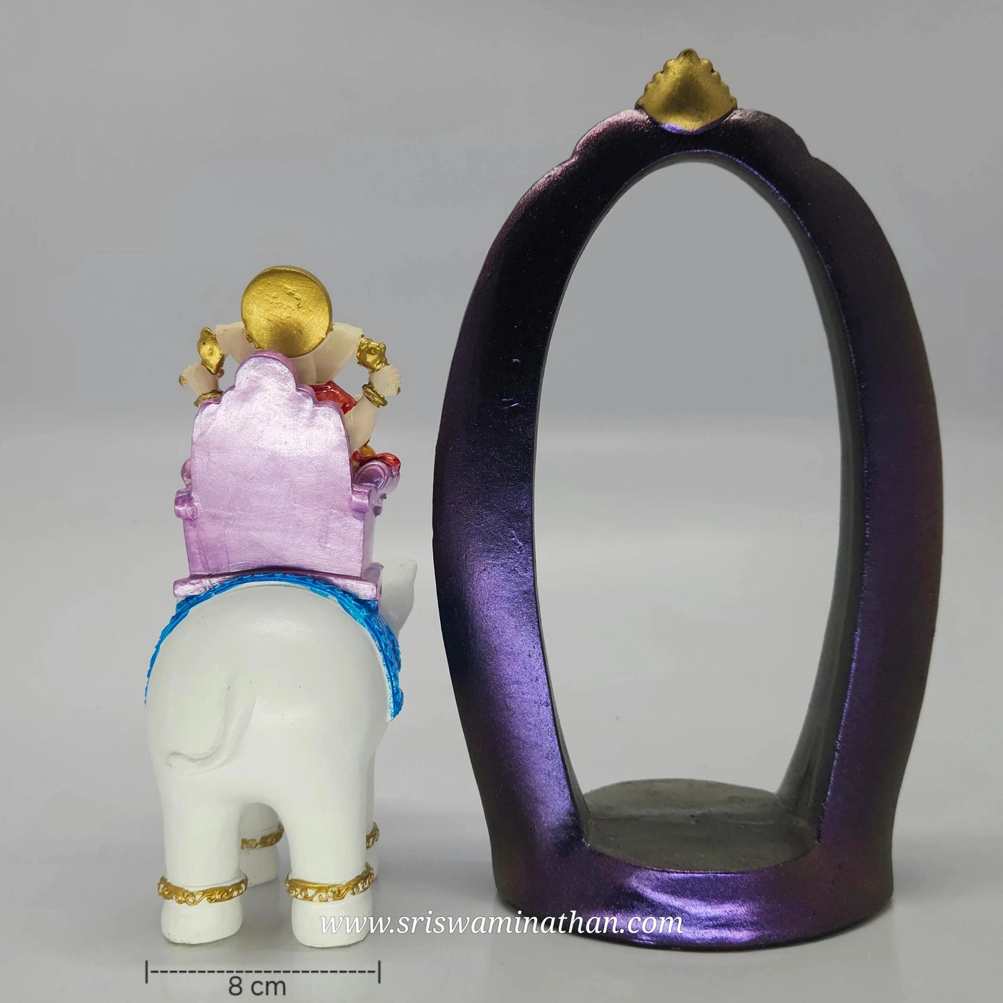 Full back view look of the Ganesha on white elephant sculpture separated away from the purple frame