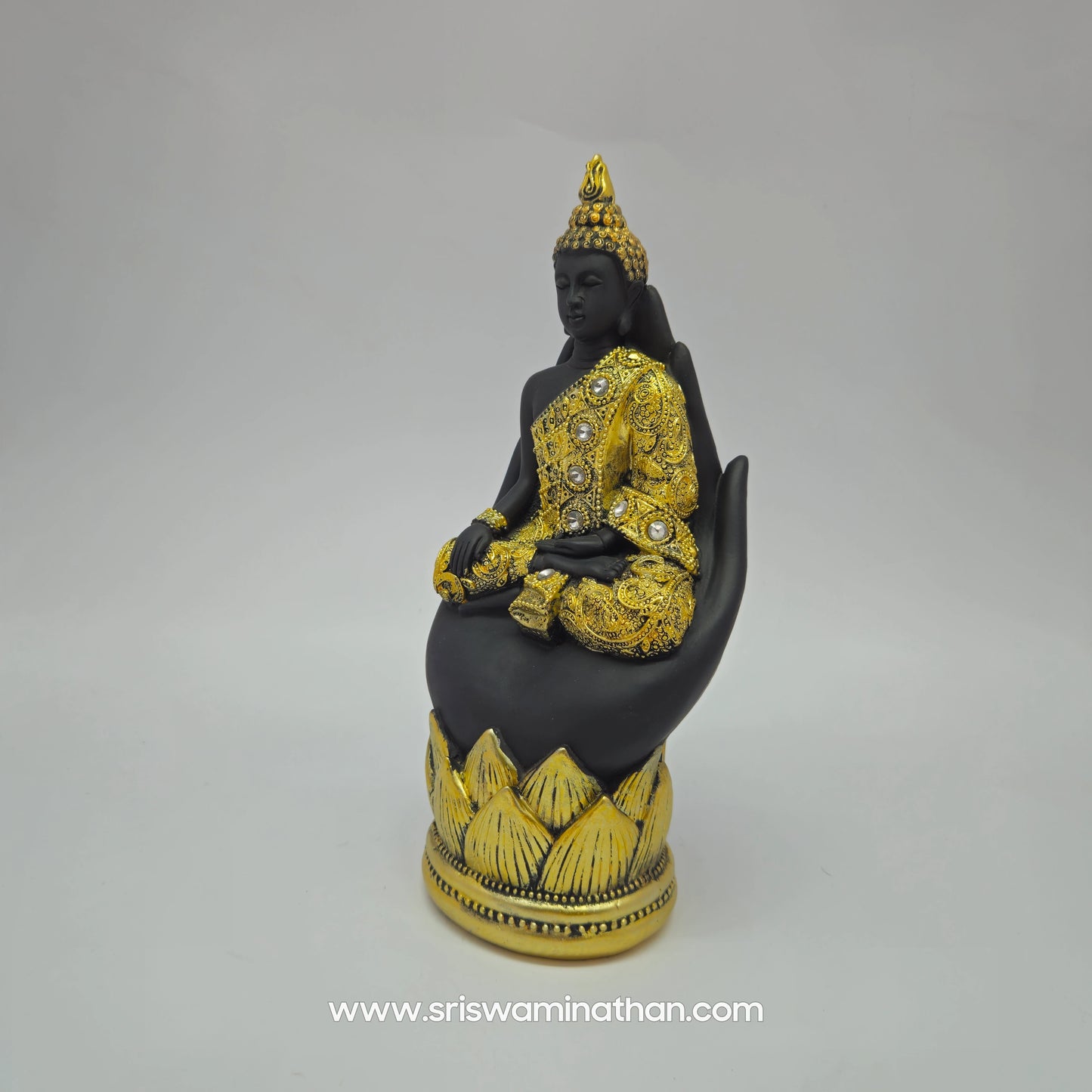Premium Resin meditating Buddha statue on hand 23cm height 45 degree left pose corner view highlighting dhyana mudra and golden robe stone work