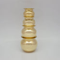 Studio shot of the brass pots stacked safely on top of each other in two dynamic pairs showing the nesting capability and rim stability of our traditional design.