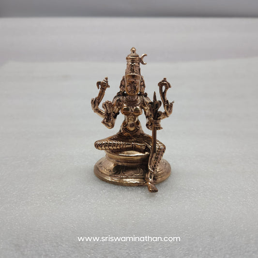 Close-up of Rajarajeshwari Panchaloha Idol four hands — Ankusha, Pasha, Pushpa Bana, Ikshudanda, Chaturbhuja form, Kumbakonam craftsmen
