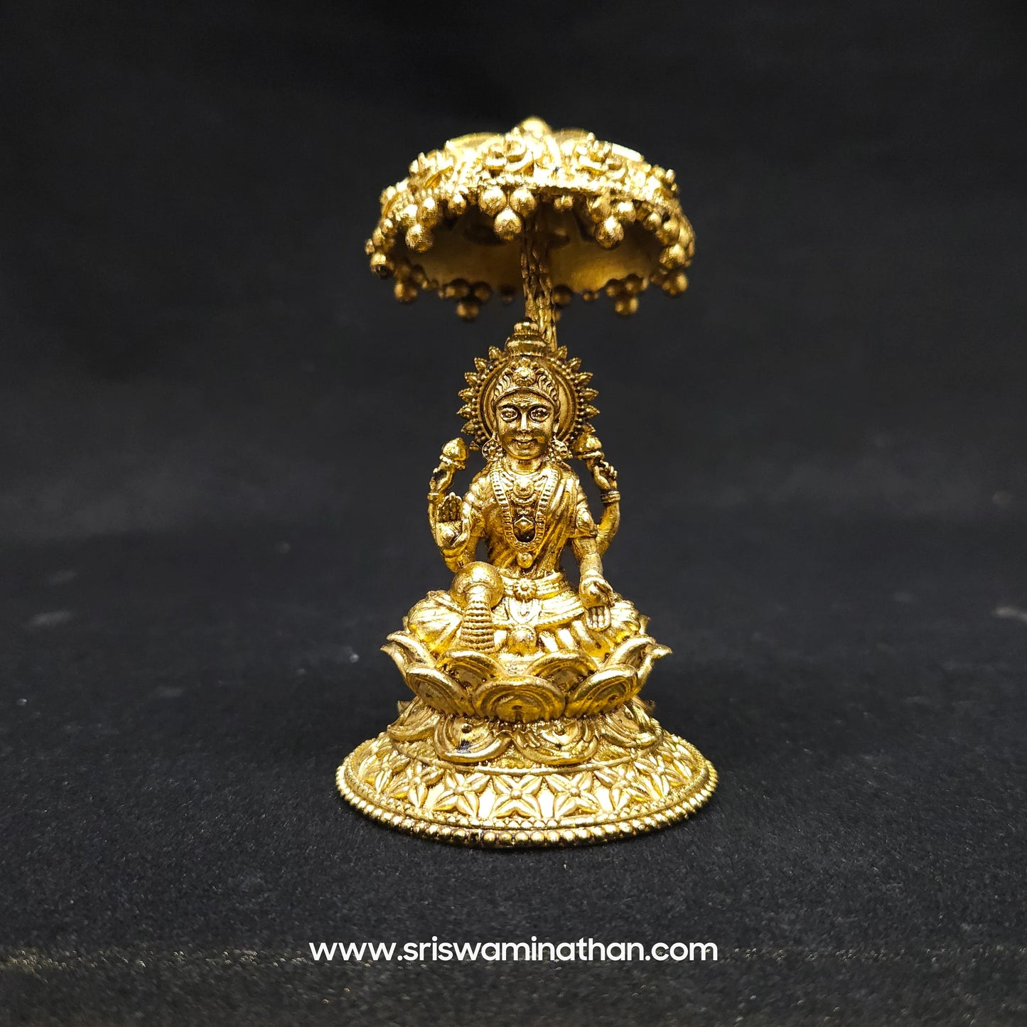 Lakshmi seated Under Umbrella Dome