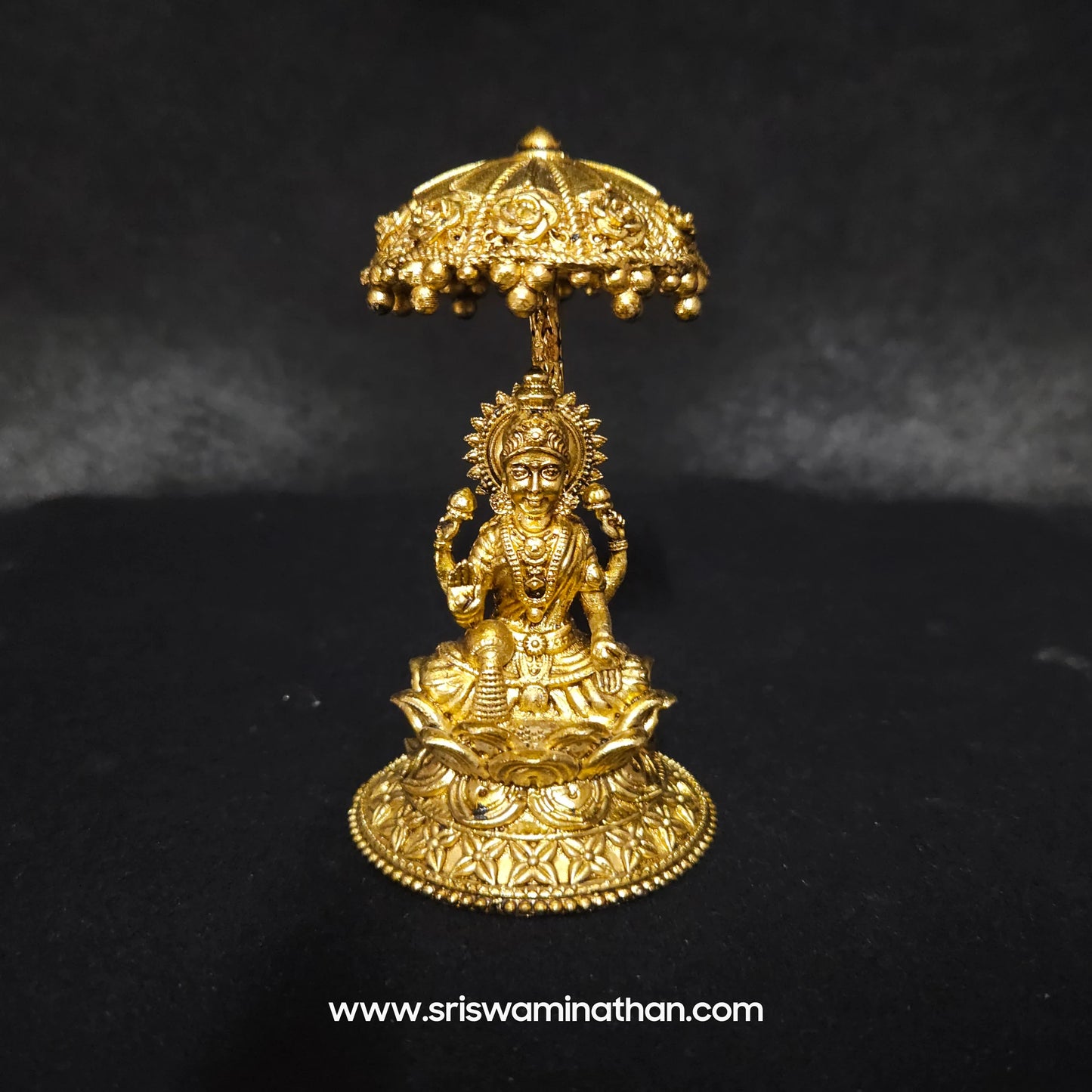 Lakshmi seated Under Umbrella Dome