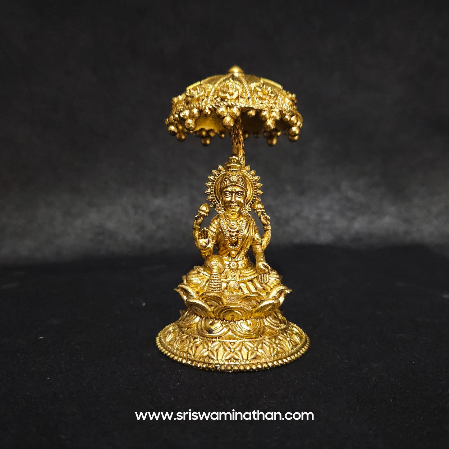 Lakshmi seated Under Umbrella Dome