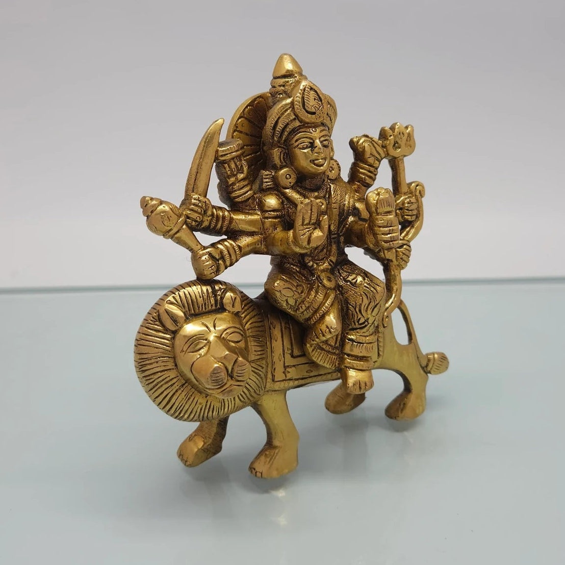 Right 45-degree perspective highlighting the fine features of the Goddess face, the raised Abhaya blessing hand, and the distinct trident structure.