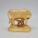 Rear view showcasing the detailed contours of the cow's tail, hindquarters, and the elegant Ganesha engraving on the back side of the saddlecloth.