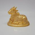Profile front view of the 13.5cm premium gold powder-coated hollow brass reclining Nandi sculpture with intricate neck bells.
