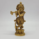 Front view of the 18cm antique solid brass Tribhanga Krishna statue with flute and peacock on a lotus base for daily pooja rituals.