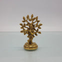 Front view of the 9.5cm antique solid brass cross-legged Balakrishna statue playing flute under a Kadamba tree for Janmashtami pooja.