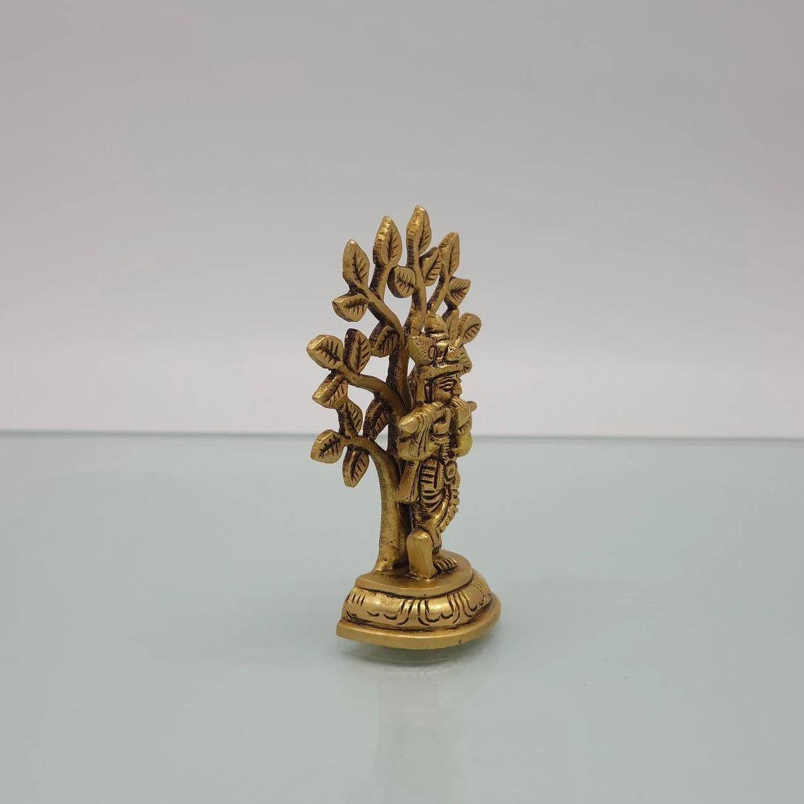 Right 45-degree perspective highlighting the fine features of the leaf outlines, Krishna's profile crown detailing, and the side base contours.