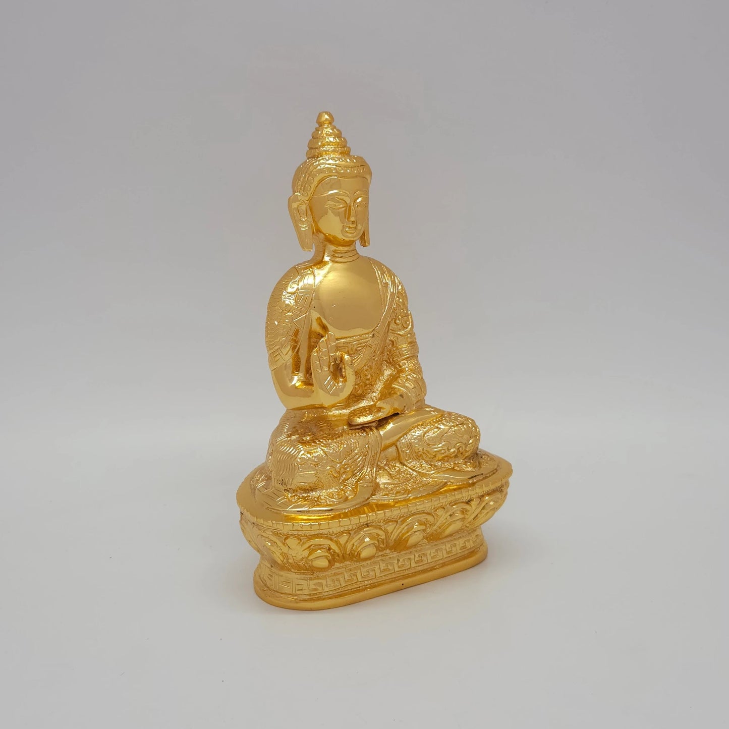 Right 45-degree perspective of the premium decorative metal Buddha idol showcasing the raised blessing hand structure