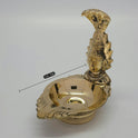 
Close-up of Nagavalli Vilakku traditional snake lamp design - Authentic Tamil Nadu serpent worship brass craftsmanship
