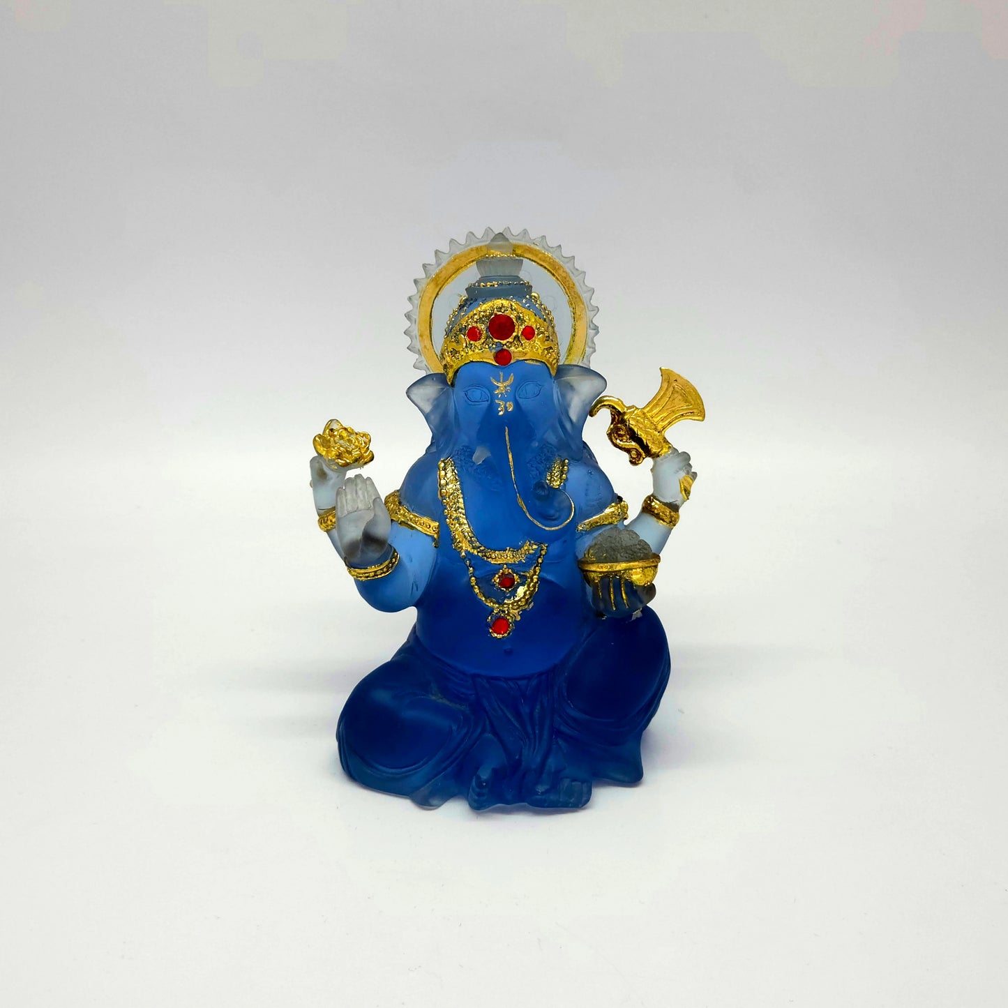 Front look of the 15 cm premium resin frosted crystal blue Ganesha idol with gold crown.