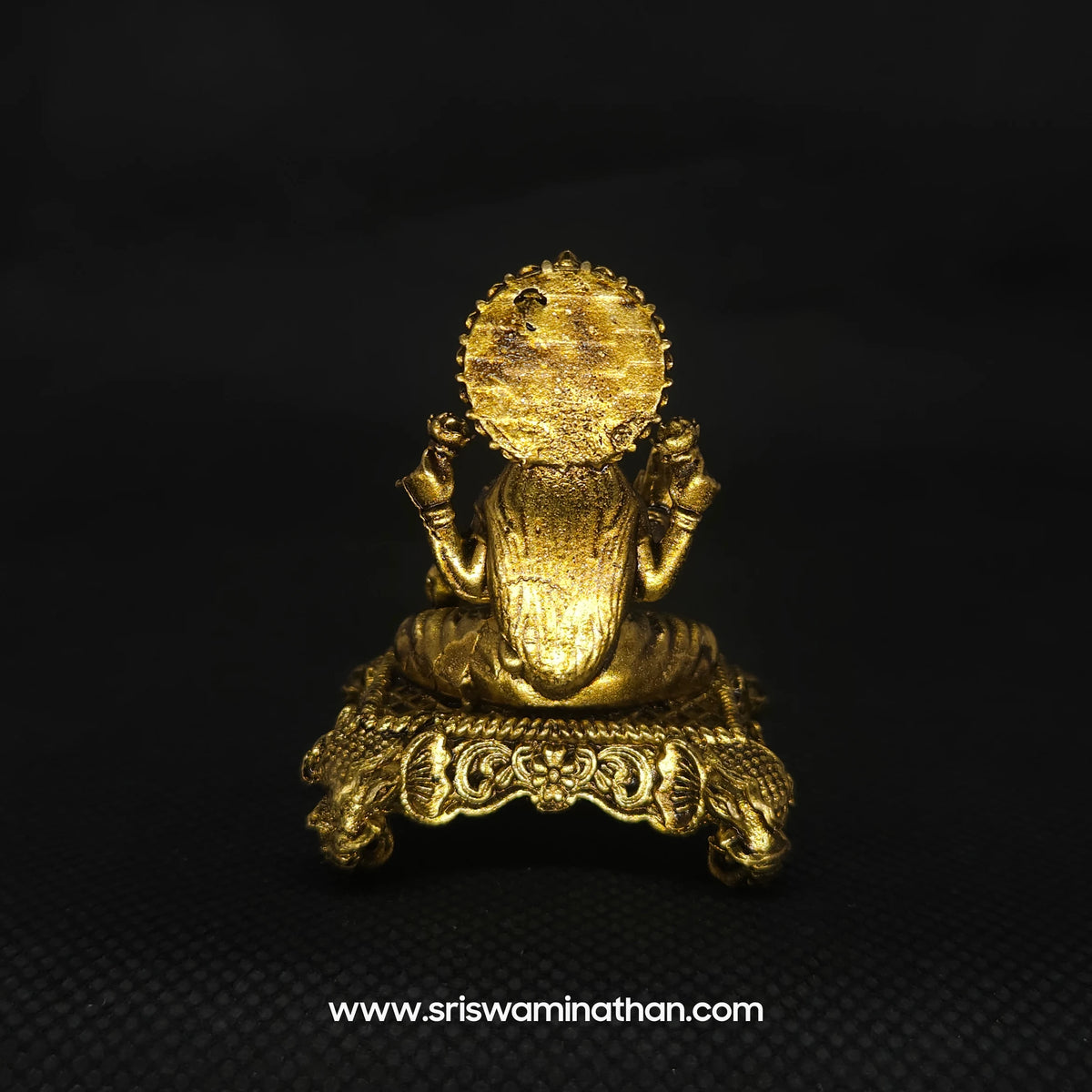 Direct straight back view of the 2 inch solid brass Lakshmi statue showing the clean reverse halo finish that stays bright with simple light dusting over long cycles