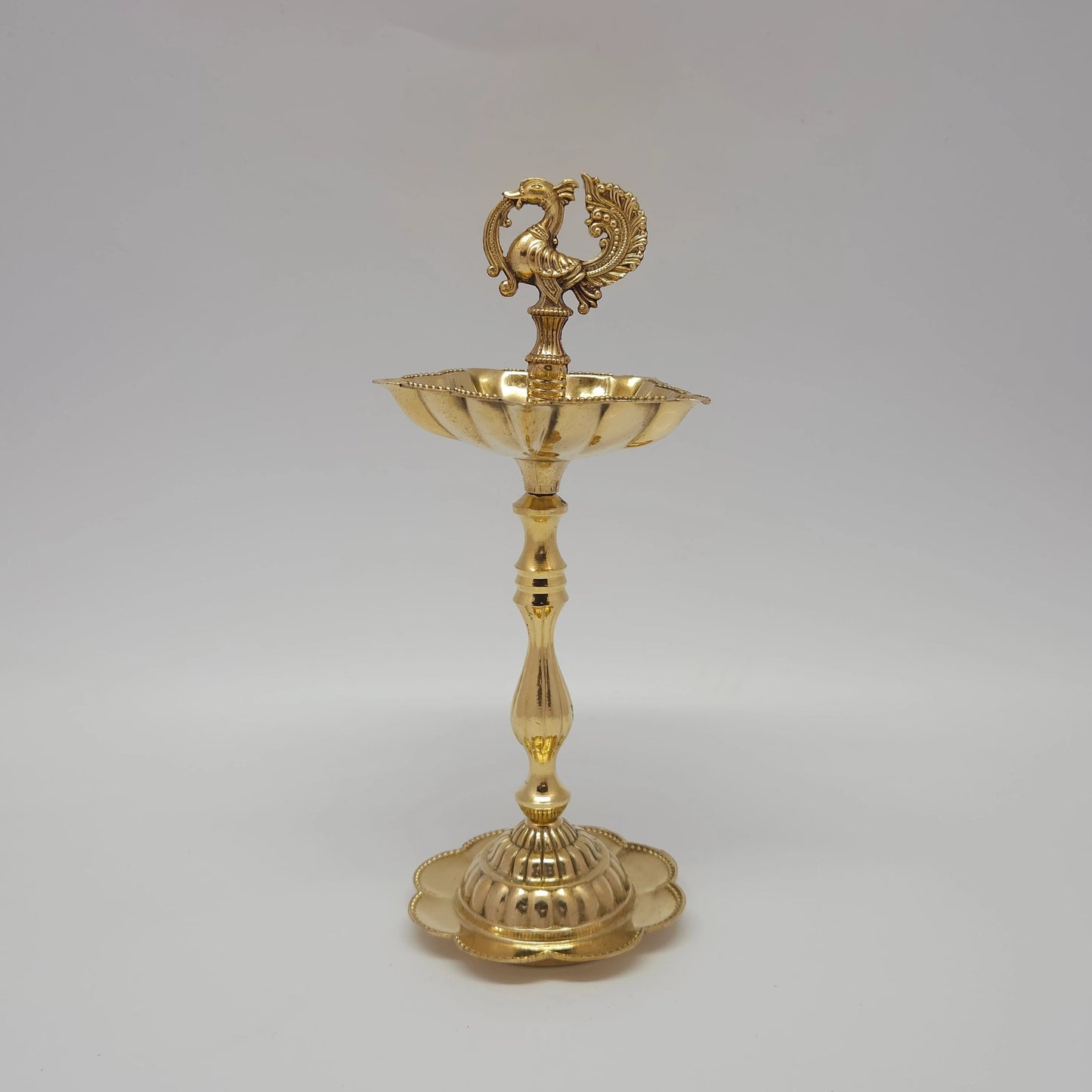  Fine quality 20 cm pure brass peacock oil lamp with a flower-shaped base stand.