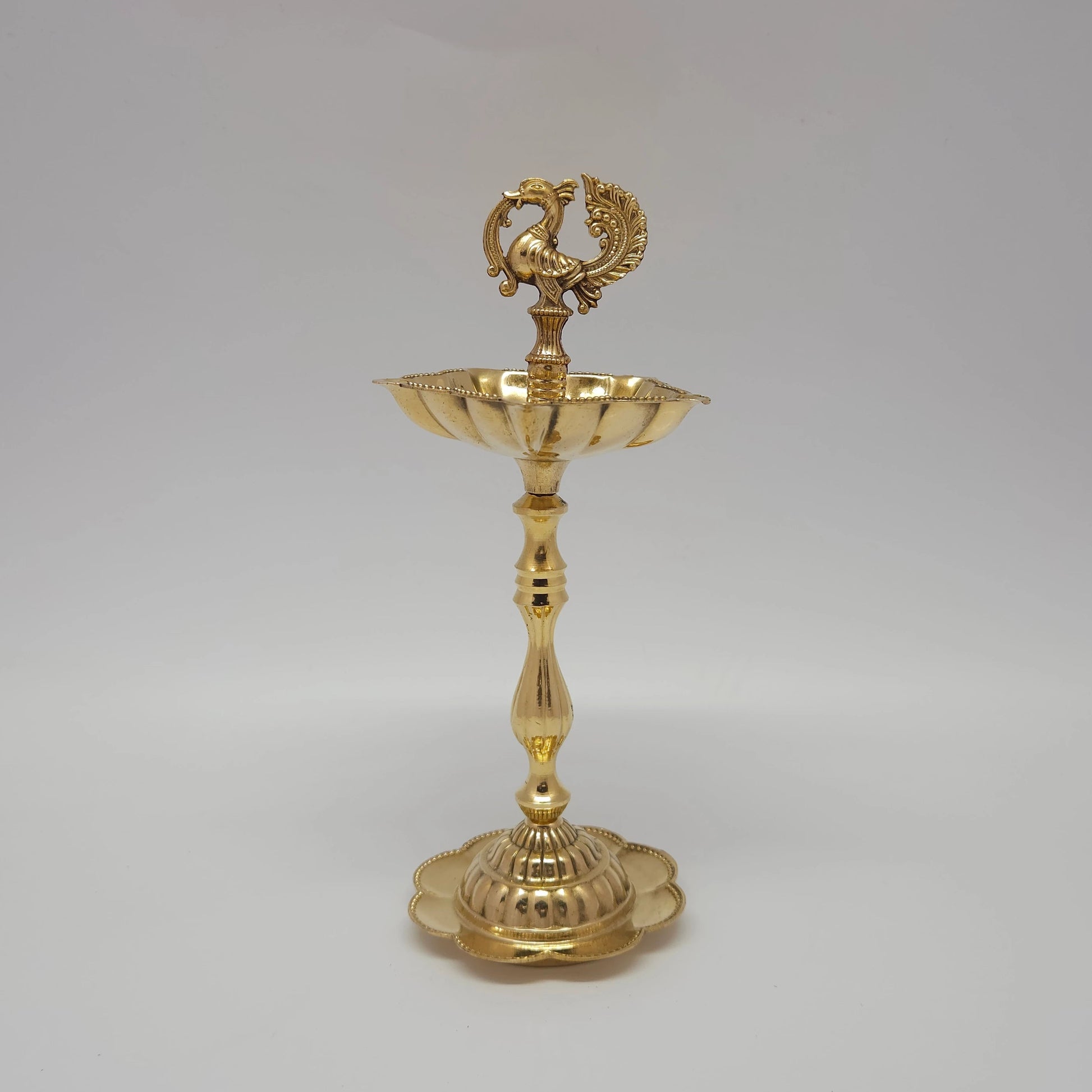  Fine quality 20 cm pure brass peacock oil lamp with a flower-shaped base stand.
