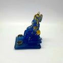 Right side profile of the 5.1 inch frosted blue resin Ganesha figurine showcasing his crown height and sturdy throne layout.