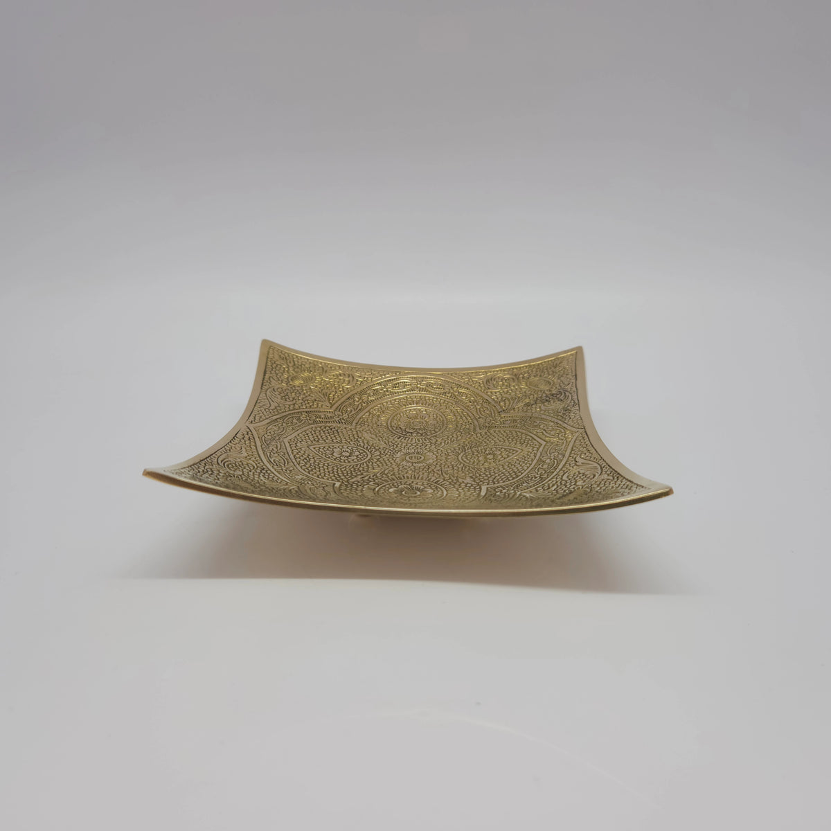 Low angle side profile view of the 5 inch geometric square brass bowl demonstrating its 3cm depth and elevated corner architectural structure.