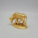 Three-quarter perspective view of the anti-tarnish gold powder-coated brass holy Gomatha cow figurine highlighting the detailed textures on the calf.