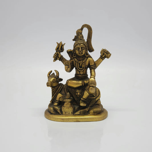 Straight front view of a 14.5cm antique-finish solid cast brass Lord Shiva statue seated with Nandi the bull and a Shiva Lingam by Sri Swaminathan and Co.