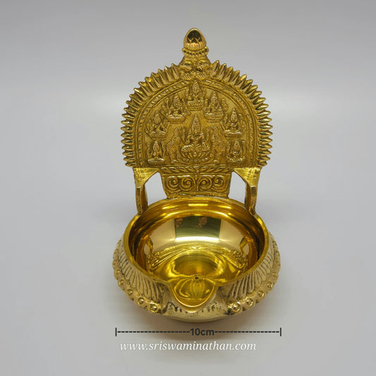 Straight front view of the 14cm brass Ashtalakshmi Kubera Nalla Vilakku showcasing the centered Gajalakshmi surrounded by seven forms of Lakshmi with length measurement marker by Sri Swaminathan and Co.