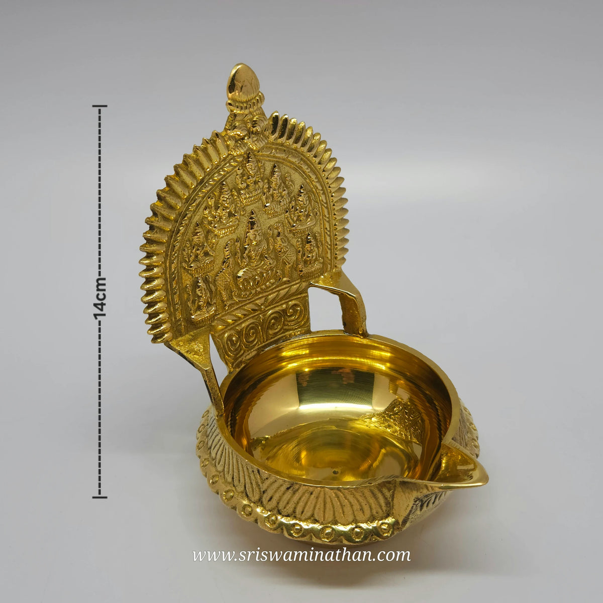 Three-quarter front left perspective view of the solid brass Ashtalakshmi lamp showing the sharp vertical ridge lines on the outer rim with height measurement marker.