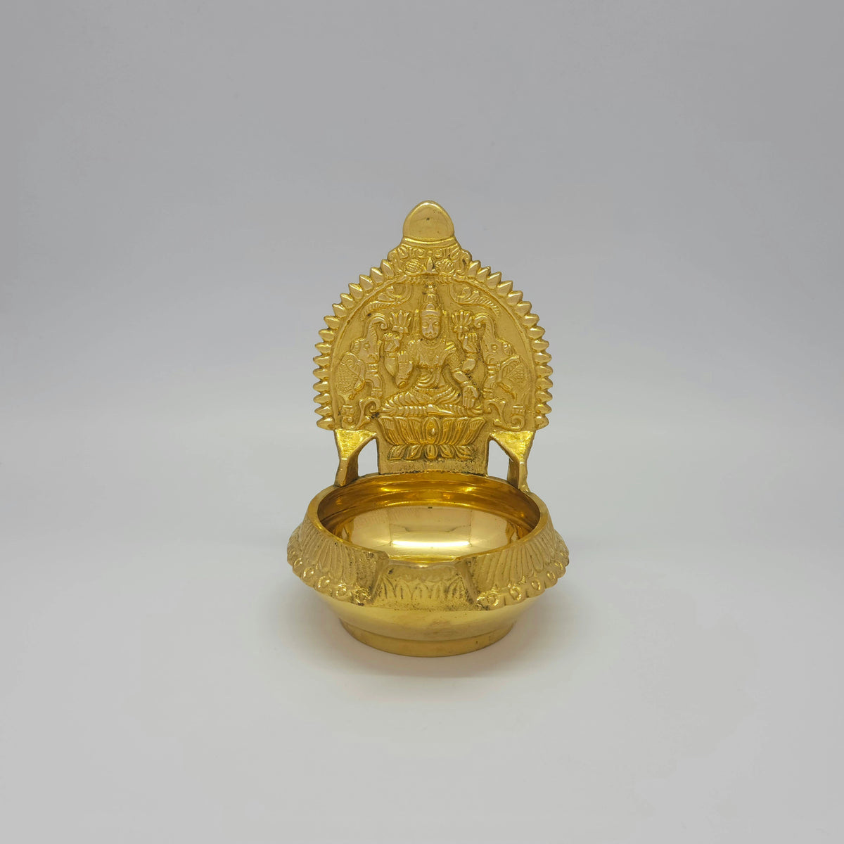 Straight front view of the 14.5cm brass Kubera Gajalakshmi Nalla Vilakku showcasing the deep oil basin and high-gloss polish by Sri Swaminathan and Co.