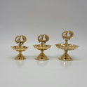 Three different sizes of pure brass peacock lamps standing side by side.