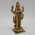  Low three-quarter front left profile view of the solid brass standing Murugan statue highlighting the tiered circular lotus peedam base platform.
