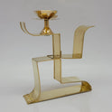 Side angle photo of pure brass Swastik shape pooja deepam showing the thickness and golden metal finish.
