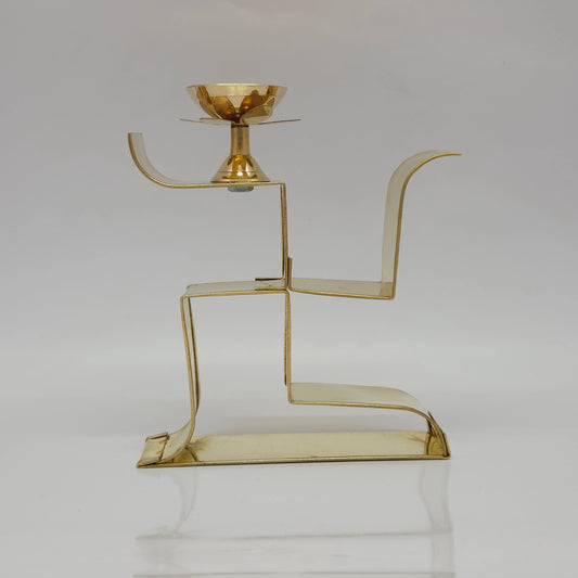Front view of 7 inch solid brass Swastik diya stand by Sri Swaminathan and Co Kumbakonam showing the single top oil cup and flat base.