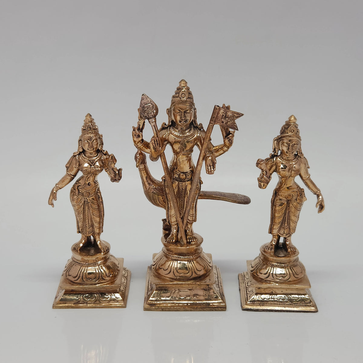Straight front view of the 5 inch handmade Panchaloha Murugan Valli Deivanai idol set standing on tiered square bases against a plain light grey background.