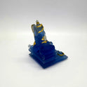 Top right angle view of the semi-transparent frosted blue Ganesha sculpture showing his divine weapons and side profile.