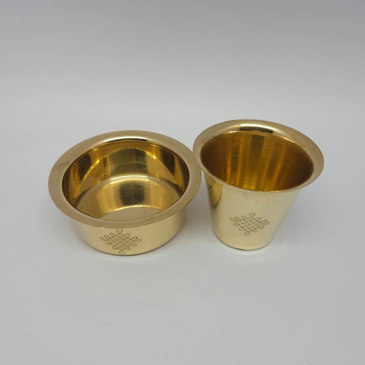 Separated side-by-side view showing the inside of the empty brass davara bowl next to the matching custom engraved filter coffee cup