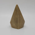 Direct straight back view of the eight centimeter solid brass mada vilakku demonstrating the smooth triangular rear finish and flat base contours.
