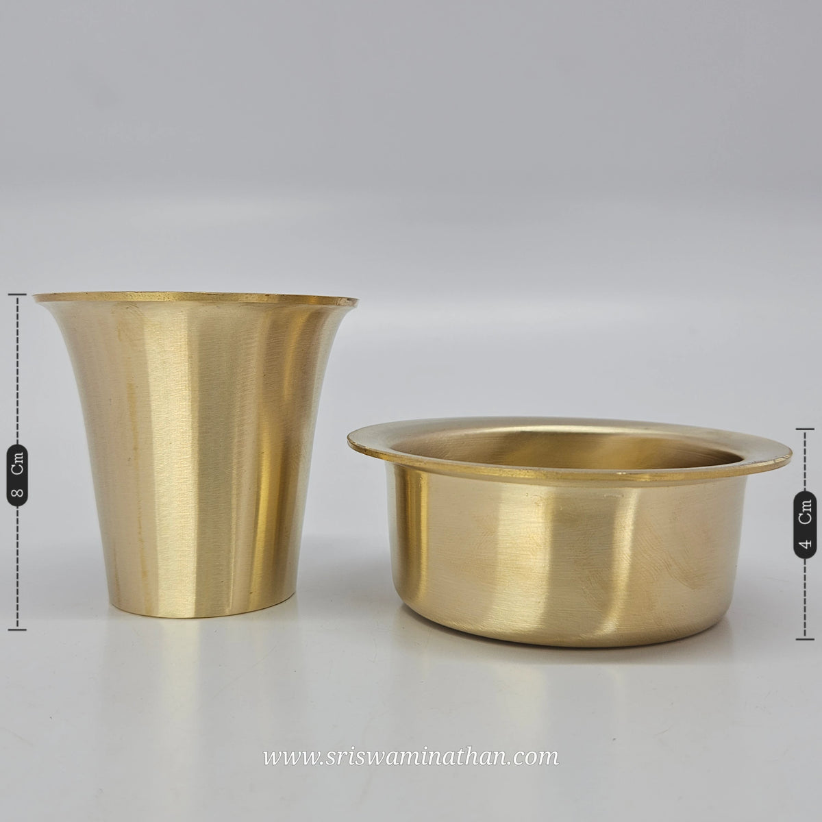 Straight side by side standing view of the eight centimeter high bronze tumbler next to the four centimeter deep dawara cooling bowl.