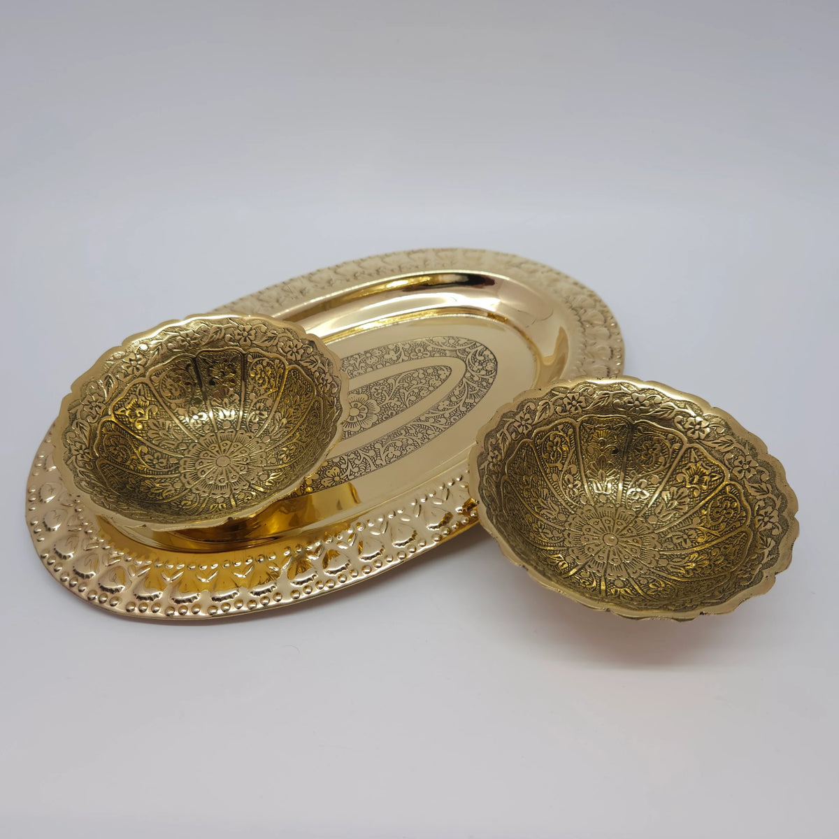 Multi-angle presentation collage displaying the 10.4cm chakra dome shaped engraved brass bowls arranged with a decorative serving tray to practically demonstrate use.