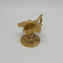 Three-quarter front right perspective view of the four centimeter brass lotus handled lamp showcasing the pointed spout wick groove and round pedestal base