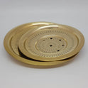 Three-quarter angled perspective view of the fourteen centimeter brass rice strainer lid highlighting the nested stepped rim contours and golden glossy luster.
