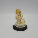 Angled front left perspective of the white resin Goddess Lakshmi figurine highlighting her traditional blessing posture and dark stepped base.