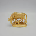 Front view of a premium gold powder-coated brass Kamadhenu cow and feeding calf statue showcasing the sacred Om symbol carved onto the base plate by Sri Swaminathan and Co.