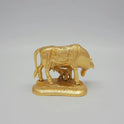 Full back view of the gold powder-coated solid brass Kamadhenu sculpture demonstrating the sacred traditional Swastika symbol engraved on the rear base platform.