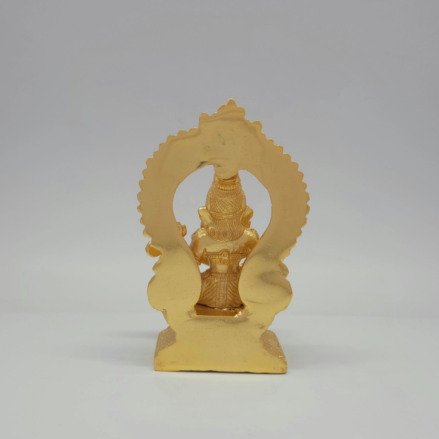 Full back view of the solid 980 grams gold powder-coated brass Saraswati statue showing the clean contours of the reverse archway backing.